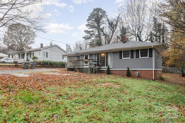 ranch-style home with a deck