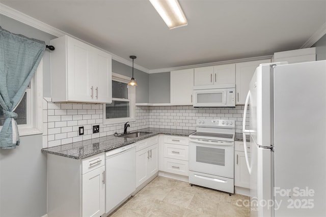 kitchen featuring decorative backsplash, white cabinetry, sink, and white appliances