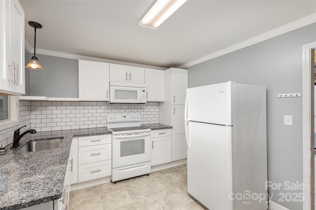 kitchen featuring white appliances, white cabinets, sink, hanging light fixtures, and tasteful backsplash