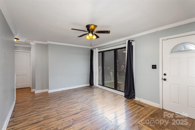 foyer entrance featuring hardwood / wood-style flooring, ceiling fan, a healthy amount of sunlight, and crown molding