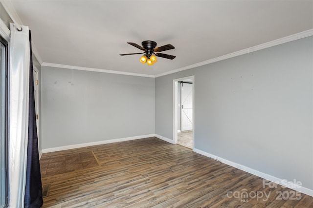 empty room with ceiling fan, wood-type flooring, and crown molding