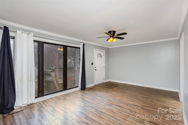 unfurnished room with ceiling fan, hardwood / wood-style floors, and ornamental molding