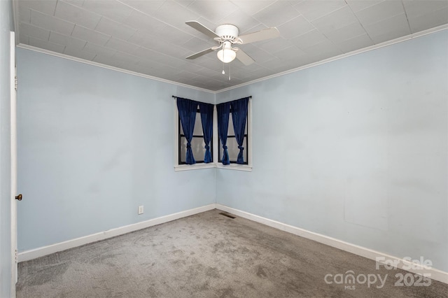 unfurnished room with carpet flooring, crown molding, and ceiling fan