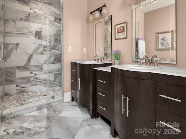 bathroom featuring vanity and an enclosed shower