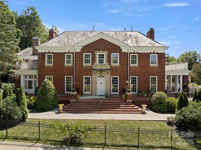 colonial house featuring a balcony