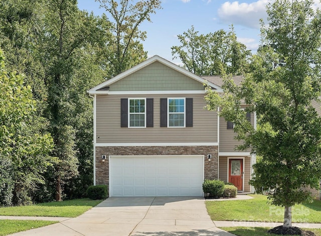 view of front facade featuring a garage and a front lawn