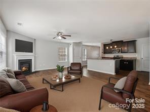 living room with ceiling fan