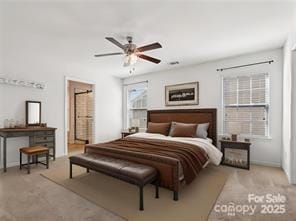 bedroom featuring ensuite bathroom and ceiling fan