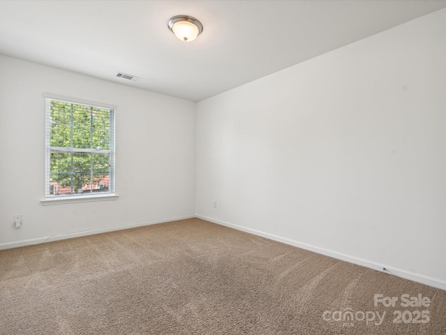 empty room with carpet flooring