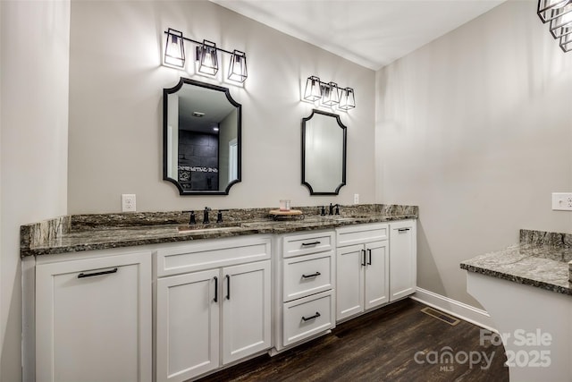 bathroom featuring hardwood / wood-style floors and vanity