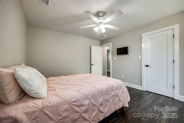 bedroom with ceiling fan and dark hardwood / wood-style flooring