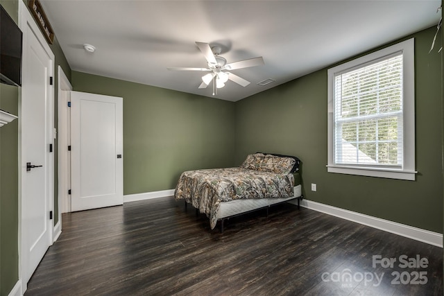 bedroom featuring dark hardwood / wood-style floors and ceiling fan