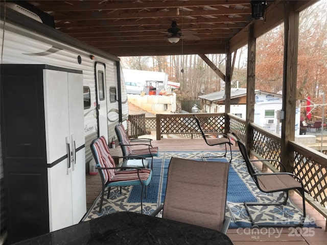 snow covered deck featuring ceiling fan