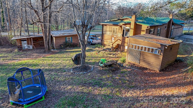 view of yard featuring a trampoline