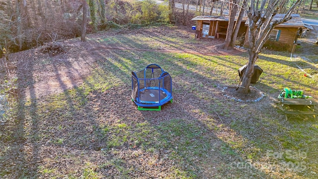 view of yard featuring a trampoline