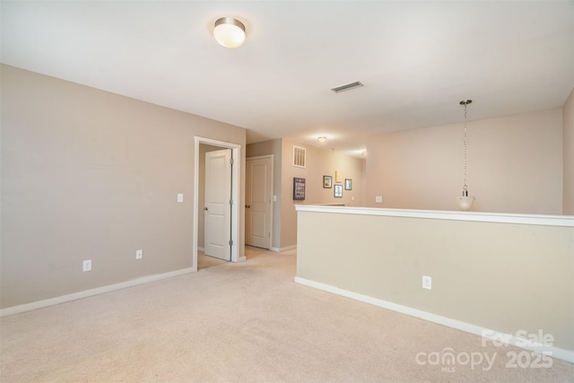 empty room with light colored carpet