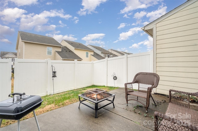 view of patio featuring a fire pit