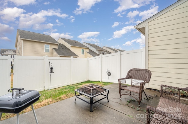 view of patio with a fire pit