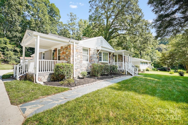 view of front of home featuring covered porch and a front yard