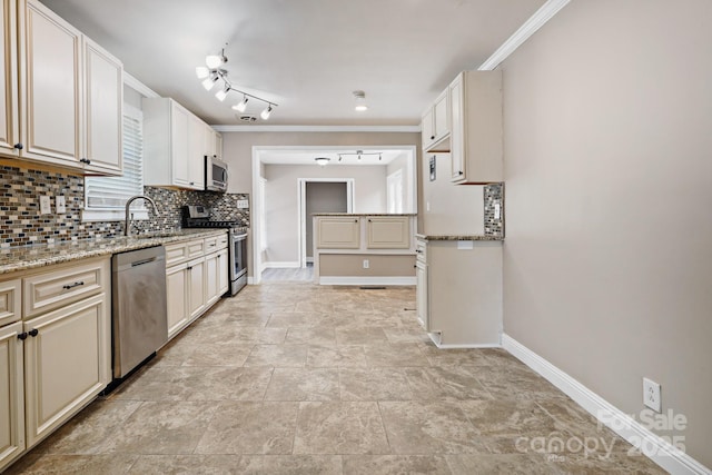 kitchen featuring tasteful backsplash, light stone counters, stainless steel appliances, crown molding, and sink