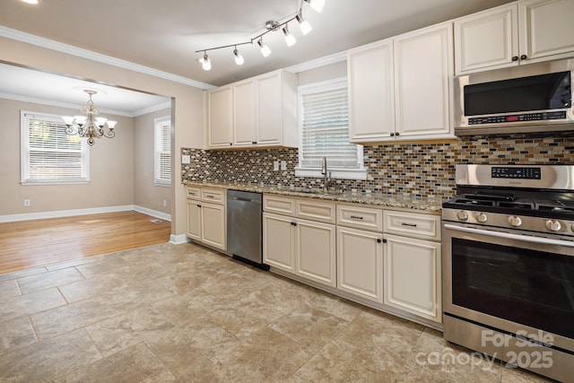 kitchen featuring appliances with stainless steel finishes, tasteful backsplash, crown molding, sink, and an inviting chandelier