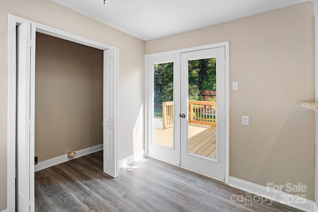 doorway to outside with dark wood-type flooring