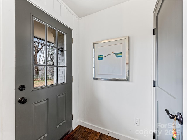 entryway with dark hardwood / wood-style floors