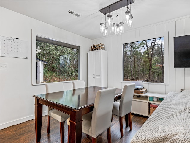 dining space with dark wood-type flooring