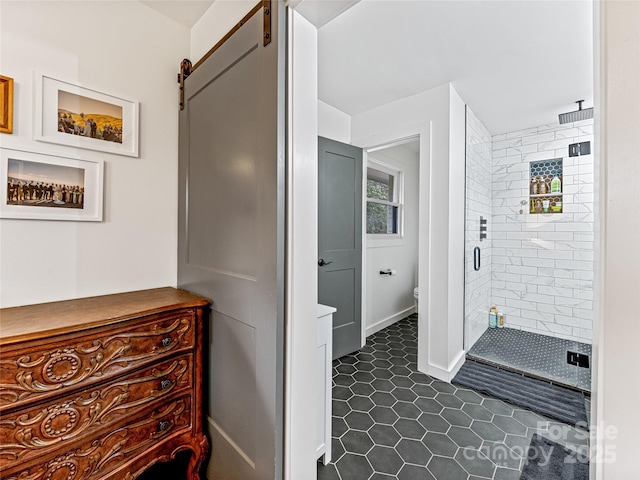 bathroom with toilet, tile patterned floors, and a shower with door