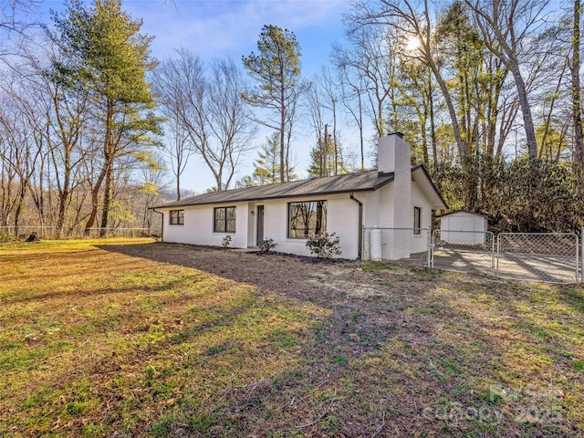 ranch-style home with a front lawn