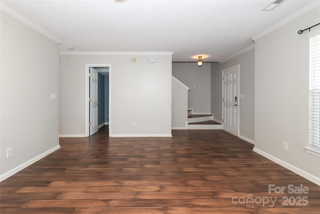 unfurnished room featuring dark hardwood / wood-style floors, ornamental molding, and a textured ceiling