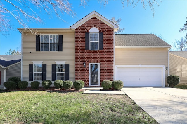 view of front of house with a garage and a front lawn