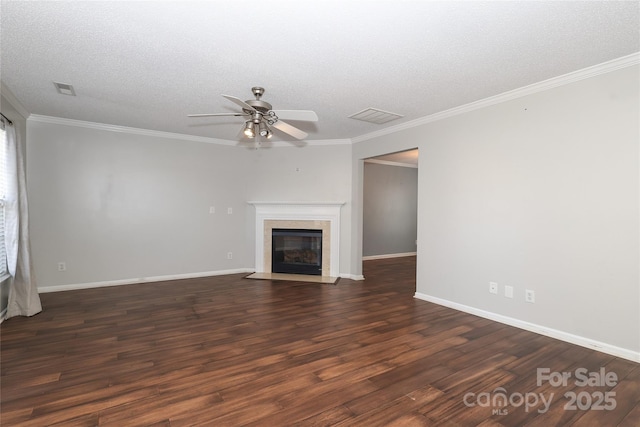 unfurnished living room with ceiling fan, a premium fireplace, dark hardwood / wood-style floors, crown molding, and a textured ceiling