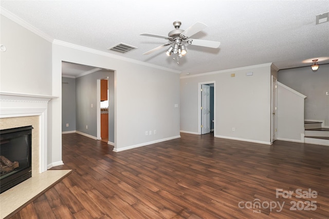 unfurnished living room with a fireplace, a textured ceiling, and dark hardwood / wood-style floors