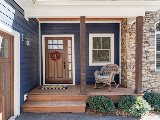 doorway to property with covered porch