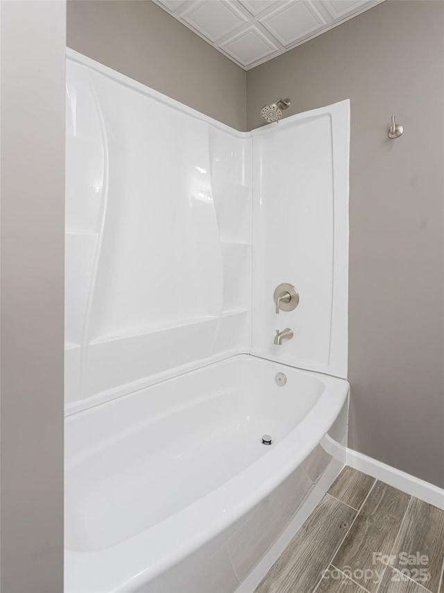 bathroom with shower / washtub combination