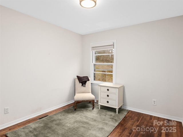 sitting room featuring dark hardwood / wood-style floors