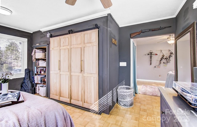 bedroom featuring ornamental molding, a ceiling fan, and baseboards