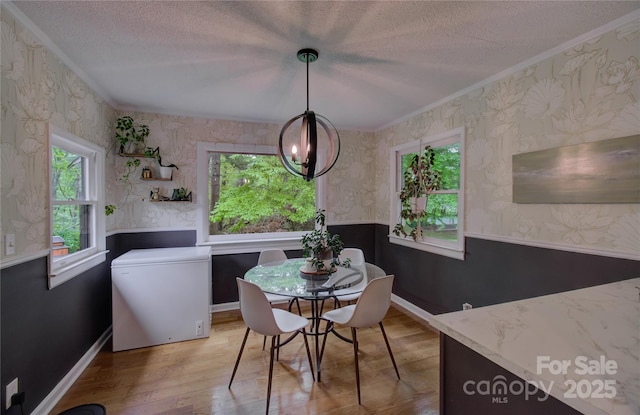 6 Candor Dr, Fletcher, NC 28732 - dining space featuring a textured ceiling, plenty of natural light, crown molding, a chandelier, and wallpapered walls