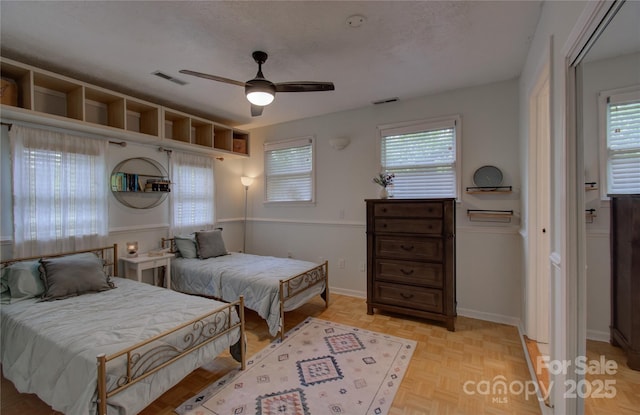 6 Candor Dr, Fletcher, NC 28732 - bedroom with multiple windows, baseboards, and ceiling fan