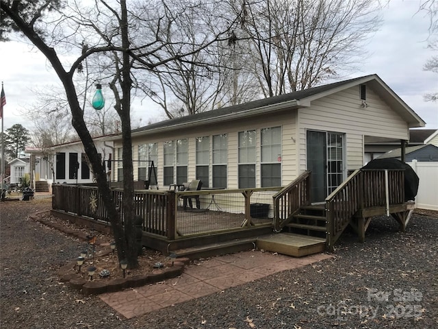135/137 Indian Harbor Trl Unit E16/17, Mount Gilead, NC 27306 - back of house featuring a deck