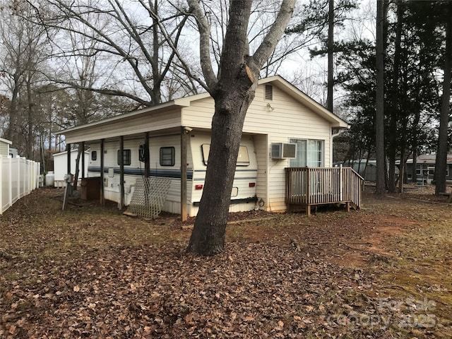 135/137 Indian Harbor Trl Unit E16/17, Mount Gilead, NC 27306 - view of side of property with a wall mounted AC