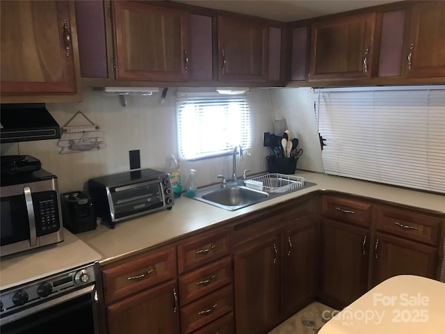 kitchen featuring range and sink