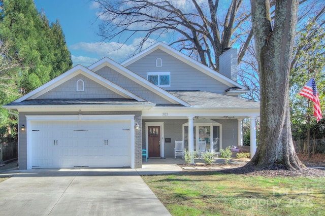 view of front of house with a porch and a garage