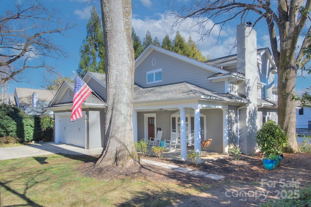 view of front facade featuring a garage and covered porch