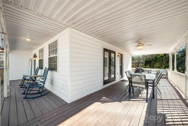 wooden terrace featuring ceiling fan