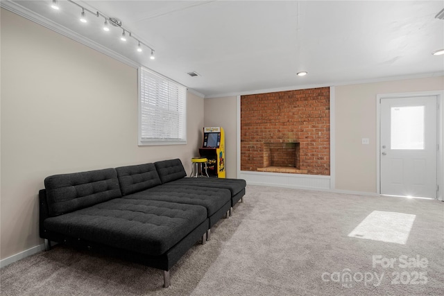 living area featuring carpet, baseboards, visible vents, ornamental molding, and a brick fireplace