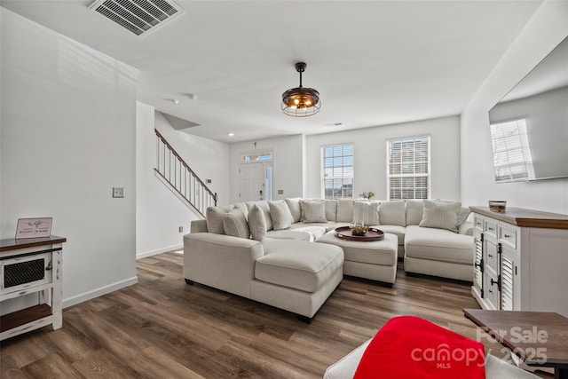 living room with dark hardwood / wood-style flooring