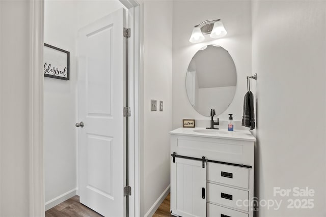 bathroom featuring vanity and hardwood / wood-style flooring