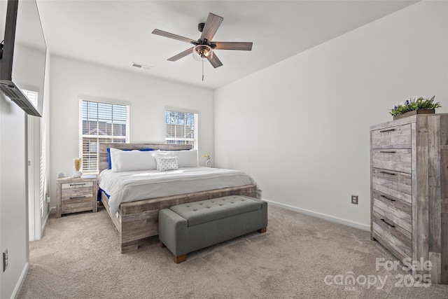 bedroom with ceiling fan and light colored carpet